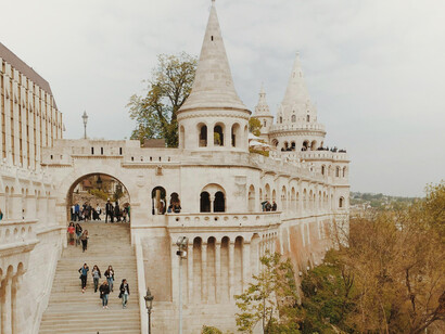 Fisherman's Bastion overlooking the Danube River with sweeping views across Budapest toward the Hungarian Parliament building and the historic banks of Buda and Pest, Budapest, Hungary