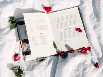 A book opened with flower petals