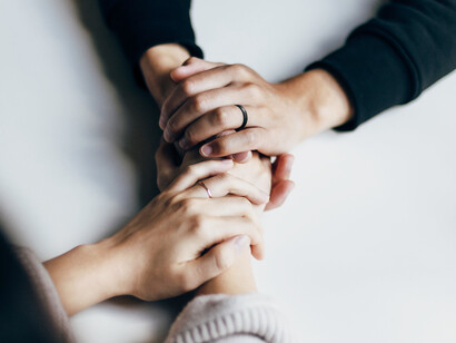 Two people having a talk, connecting closely with touch