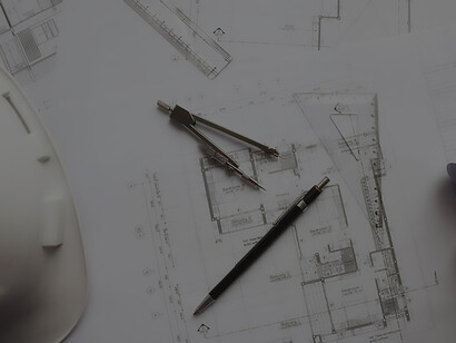 Architect meticulously sketching plans with a pencil on a blueprint, exemplifying expertise in architectural design