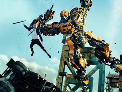 Bumblebee launches through the air with Sam Witwicky thrown alongside him, symbolizing Bay’s ability to find striking imagery within overwhelming action of Transformers: Dark of the Moon (2011)