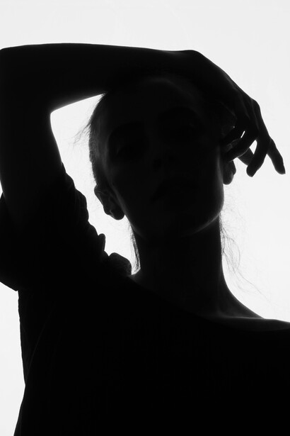 A silhouette of a solitary girl, symbolizing the search for identity