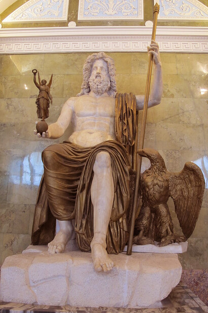 The Statue of Zeus at Olympia was a colossal chryselephantine (gold and ivory) sculpture created by Phidias in the 5th century BCE, depicting Zeus seated on a grand throne, and was considered one of the Seven Wonders of the Ancient World