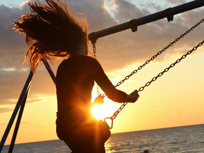 A woman choosing to swing for happiness
