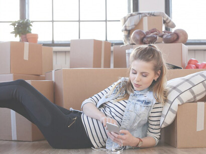 With the decluttering done, the woman reclines on the floor, enjoying a newfound sense of clarity and freshness
