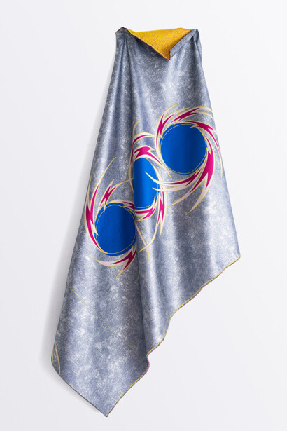 Liz Collins, Lightning Wheel Cape (b/g/r/y), 2023. Lurex, polyester, and silk, 86 x 40 in. Courtesy of Luis De Jesus Gallery