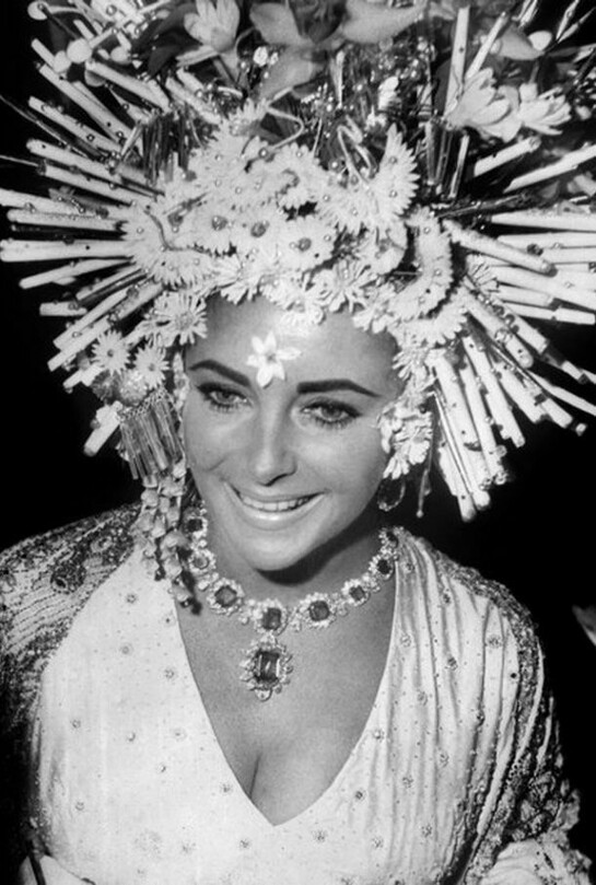 Elizabeth Taylor wears Bulgari jewellery at the masked ball, Hotel Ca'Rezzonico, Venice, 1967