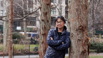 Maya Lin, American designer and sculptor, within her “Ghost Forest” (2021) installation. Courtesy of the artist and Madison Square Park Conservancy. Photo credit: Andy Romer