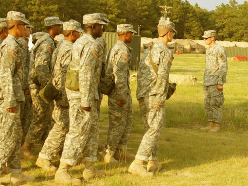 Young boys learning army drills