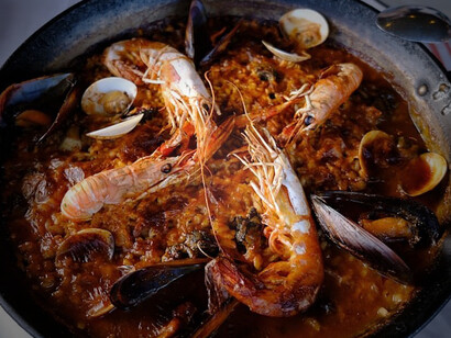 The essence of Mediterranean cuisine with our delectable creation featuring perfectly cooked shrimps paired with aromatic rice, a true embodiment of Spanish culinary excellence