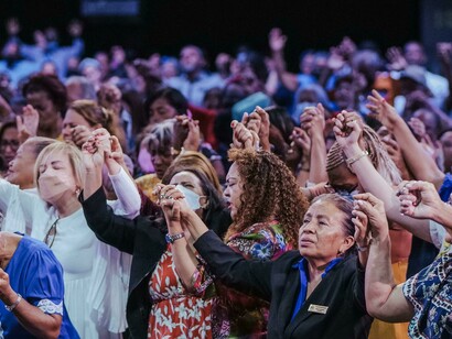 People assembled in a church setting, capturing the enduring presence of faith in contemporary public life