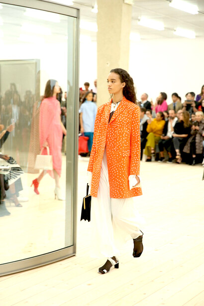 Models walk the Celine runway, presenting the brand’s refined silhouettes and understated luxury aesthetic