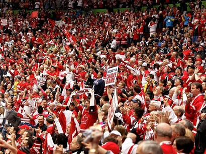 Canadian fans erupt in celebration as Corey Perry scores in the second period, extending Canada’s lead to 2-0 over the USA with half the game remaining in the 2010 Winter Olympics
