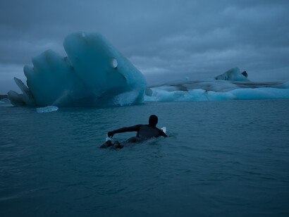 Swimming in frozen water. Photograph Chris Burkard