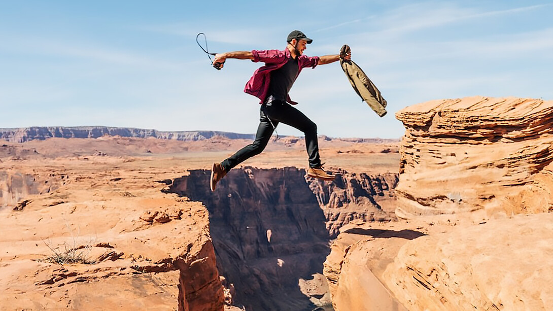 Man jumping on rock formation