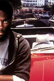 The poster for the movie “Beverly Hills Cop” with Eddie Murphy written by Danilo Bach