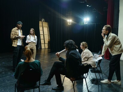 Actors preparing for a performance on the theatre stage