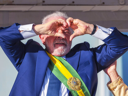 As Lula stands before the cheering crowd at The Palácio do Planalto in Brasília, Brazil, his administration's success with Bolsa Família serves as a model for global efforts to reduce hunger and enhance social equity