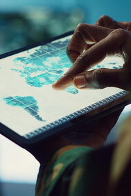 An IT professional leverages artificial intelligence and geospatial technology to gather insights from world map projections, utilizing the power of generative AI for enhanced data analysis