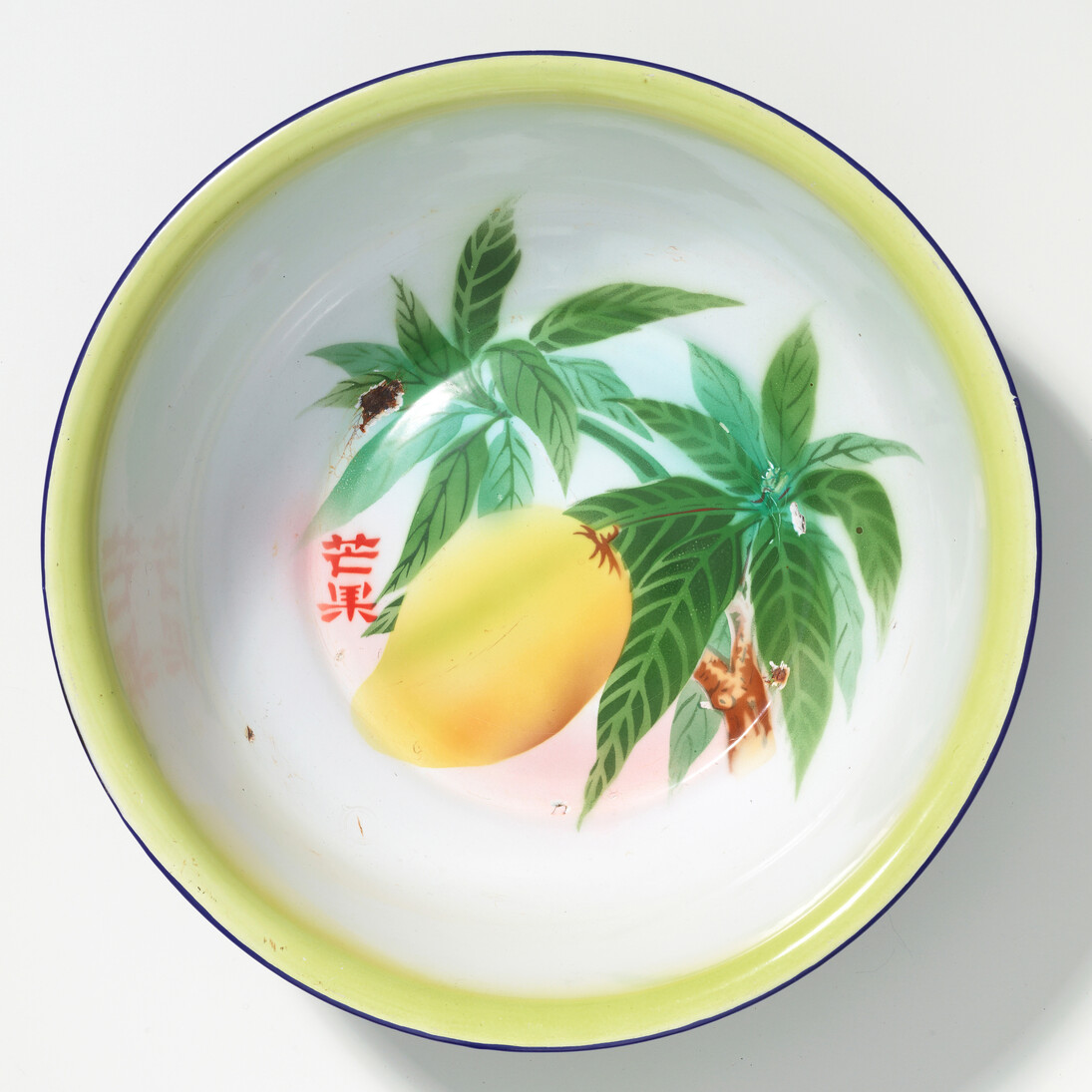 Wash basin with design of a mango branch, c. 1968, Industrial enamel, H 10.2 x Diam. 34.5 cm