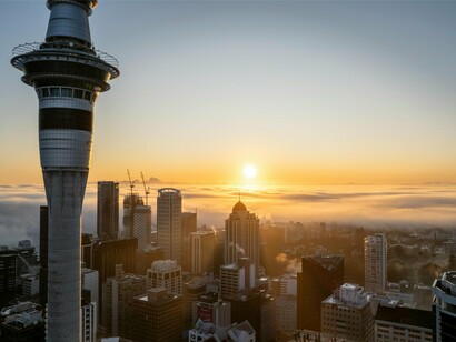A clouded Auckland skyline, underscoring how innovation and R&D investment can lift the haze of volatility for small economies