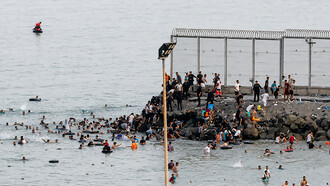 An estimated 60,000 people crossed from Morocco into Ceuta, overwhelming local authorities and triggering a humanitarian and border security crisis