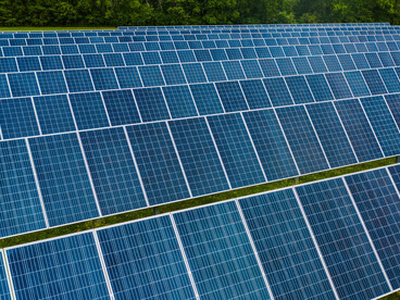 Rossville, GA, United States features a vibrant solar farm with rows of photovoltaic panels capturing energy