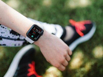 A person wearing a smartwatch while staying active outdoors, representing the importance of protecting health and well-being in a changing climate