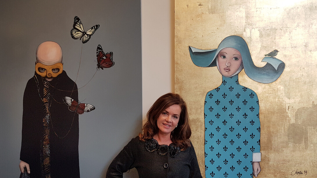 Lisbeth Lunda with her paintings Denial and Father, ph, Irene Kukota