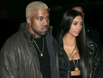 A dazed Kanye West is alongside his now ex-wife Kim Kardashian