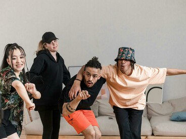 A group dancing together as they record a video for social media