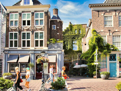 Bikes are lined up next to each other along a street in Utrecht, the Netherlands, creating a typical scene of the city's cycling culture