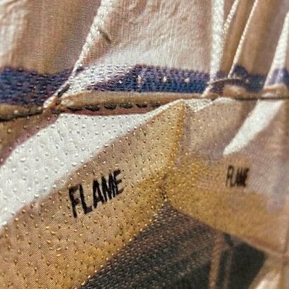 Luanne Rimel, Firewall (detail),
photograph printed on silk, hand-stitched with cotton embroidery thread,
29" x 29",
2024. Courtesy of the artist and Duane Reed Gallery