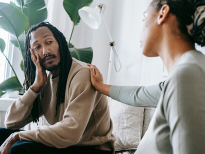 A woman listening to a man, offering her support
