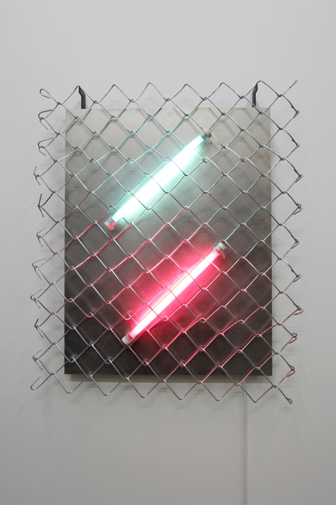 Hold, Mark Davey, 2015
Painted steel, fluorescent lights, chain-link fence, stainless steel, 73 cm x 60 cm. Courtesy of the artist and The RYDER Projects, London
