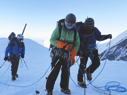 Climbers scaling a mountain peak in the breathtaking Himalayas of Nepal