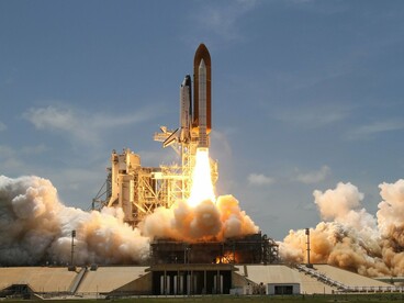 A powerful rocket launch, reflecting a milestone in commercial space exploration
