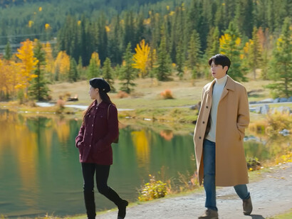 Ho-jin quietly following Mu-hee by a peaceful lakes, representing that love grows stronger when built on patience and trust