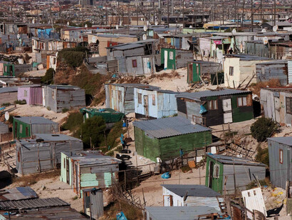 The harsh reality of poverty in Khayelitsha township, Cape Town, South Africa, is captured in this image, serving as a sobering reminder of the multifaceted nature of inequality that policies like B-BBEE seek to confront but often struggle to fully address