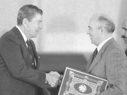 President Ronald Reagan (left) shaking the hand of Soviet leader Mikhail Gorbachev