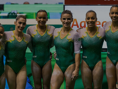 The Brazilian women's team lines up after competing in the qualification round at the 2016 artistic gymnastics Olympic test event