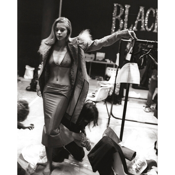 Jaime King getting dressed for the SS show The Birds, Bagleys Warehouse, 1995; Image Courtesy of Proud Galleries © Gary Wallis