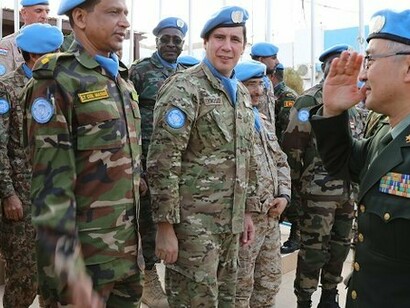 MINURSO Force Commander greeting a military parade at the UN mission