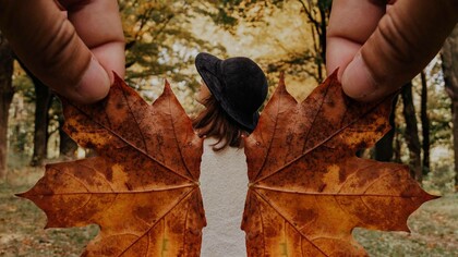 Leaves being used as wings to creatively give the person the power of flight