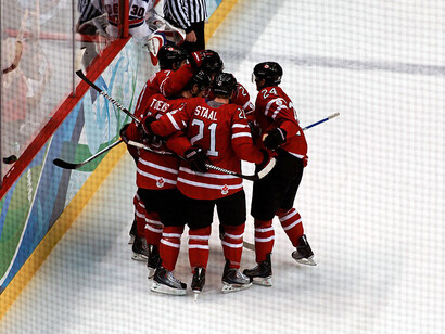 Canada forward Eric Staal (#21) celebrates with his teammates after scoring a goal against the United States during the 2010 Winter Olympics