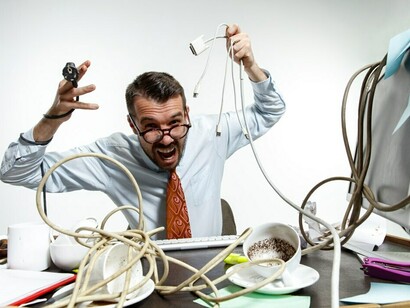 The constant presence of tangled wires in the workplace adds to the stress and digital anxiety, intensifying the fast-paced environment
