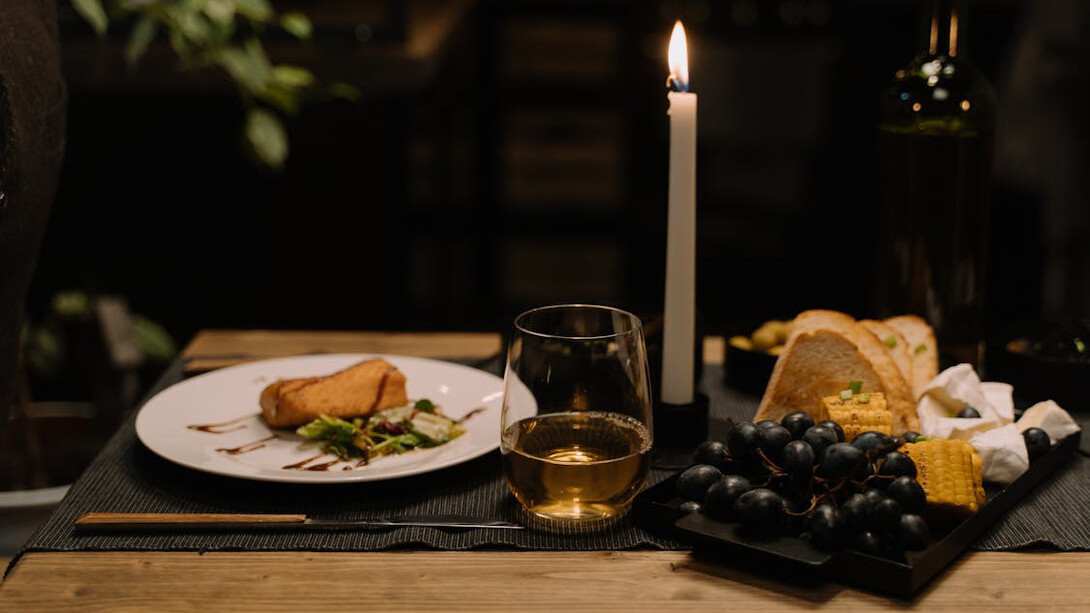 In the midst of chaos and uncertainty, a candlelit dinner offers a comforting reminder that, despite the world's troubles, simple pleasures still abound