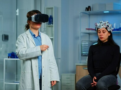 A woman researcher analyzing a brain scan on a monitor, exploring AI healthcare applications and smart healthcare solutions for advanced diagnostics