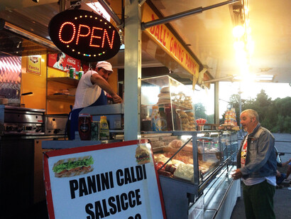 Mimmo serving a customer