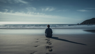 A solitary figure sitting by the vast sea, representing the quiet ache of emotional isolation